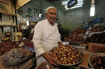 A vendor in Kuwait selling Dates