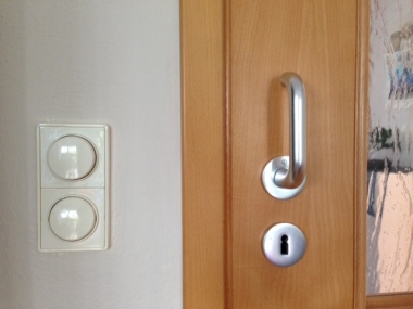 Round light switches and round old-fashioned key holes. In Germany, door knobs don't turn so always bring your key when you go out!